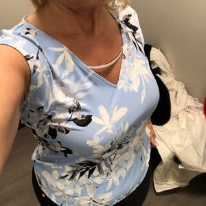 Blue fitted blouse with scoop neck and cap sleeves